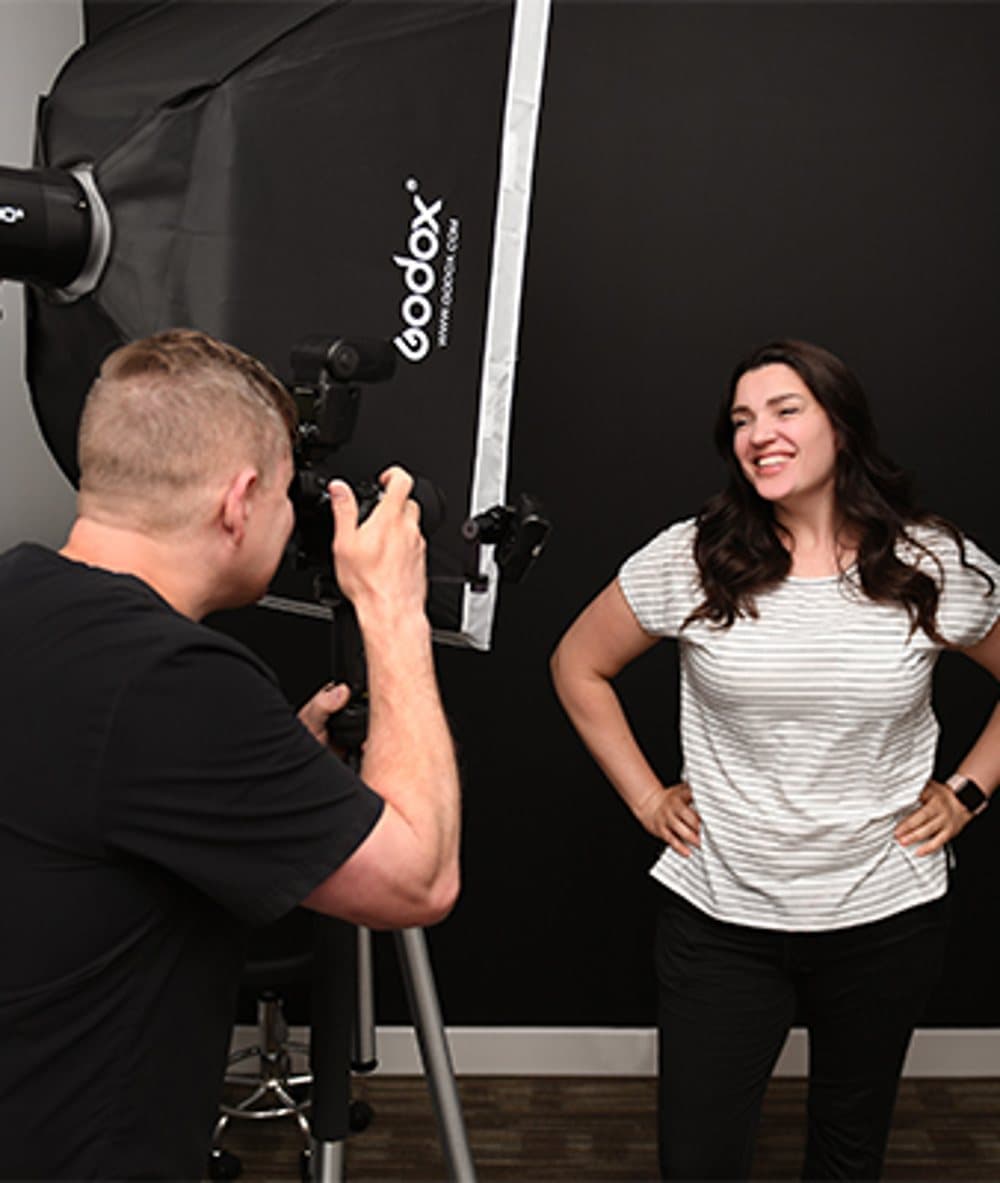 Dr. Clark's team photographing a patient's smile for precise aesthetic planning
